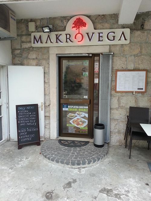Outside of restaurant with daily menu shown. at Makro Vega in Split