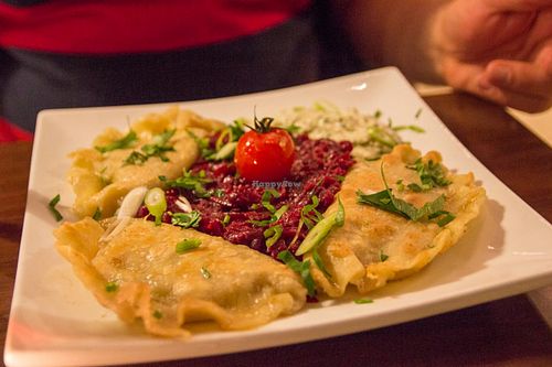 Pirogi filled with mushrooms and sauerkraut, besides a beetroot salad with garlic at Wondergood in Frankfurt