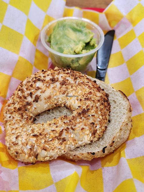 Onion ans garlic bagel and avocado at Galveston Bagel Company in Galveston