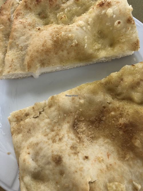 Focaccia di Recco: a typical focaccia from Liguria, filled with vegan soft cheese  at Ratatouille in Turin