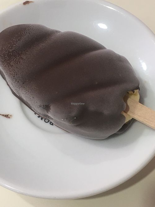Vanilla gelato stick covered with dark chocolate  at Ratatouille in Turin