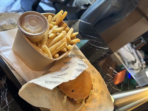 smash burger and french fries  at Pas in Milan