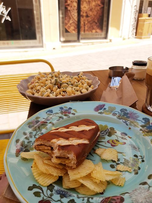Vegan toasted sandwich and side of chips at Tiny Rebels in Crete