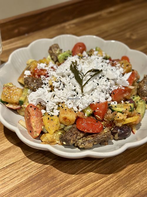 A delicious salad with vegan cheese  at Tiny Rebels in Crete