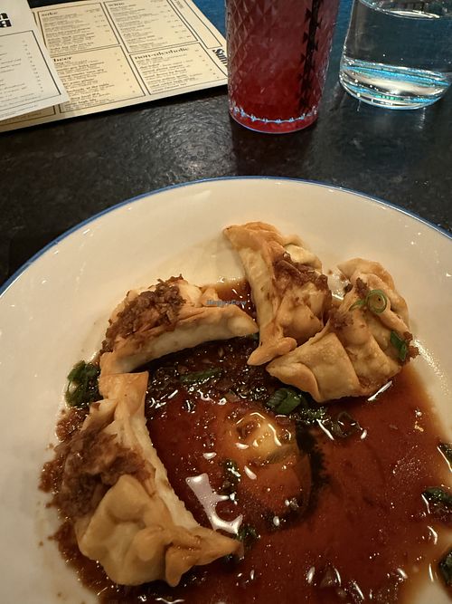 Veggie dumplings after I couldn’t wait and ate one. Crispy wrapper. Very tasty.   at Sum Bar in Greenville
