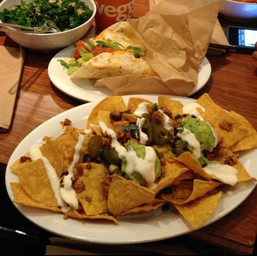 Mondo Nachos (forefront) at Veggie Grill by Next Level in La Jolla
