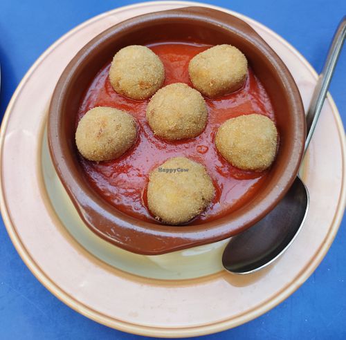 Breaded plantain balls in tomato sauce. at Habanita in Sevilla
