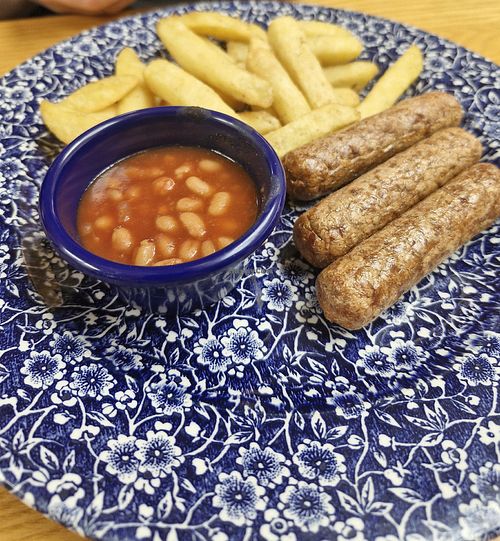 Vegan sausage,  beans and chips at The Mail Rooms in Ross-on-wye