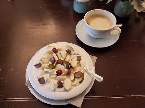 Vegan fruit salad and cappuccino at Cafe Huttner in Inning Am Ammersee
