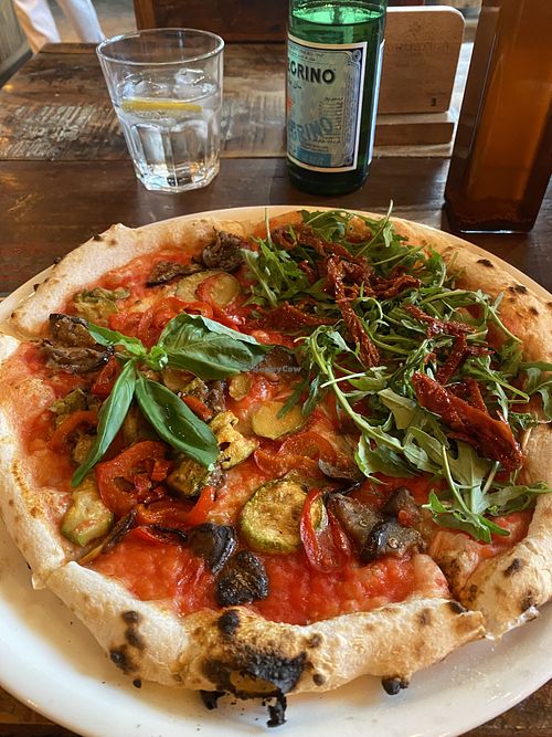 Rucola and vegetariano half:half pizza   at La Rustica Pizzeria in Riyadh