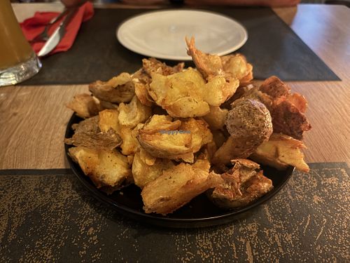 Smashed potatoes. They come with a cheese dip but that is on the side  at Colombo Kitchen & Bar in Crete