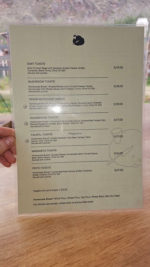 Menu, vegan items marked with a leaf on the left at Sofra Toast in Pisac