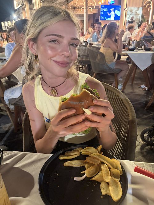 Eating my vegan burgie  at Café Remezzo in Crete