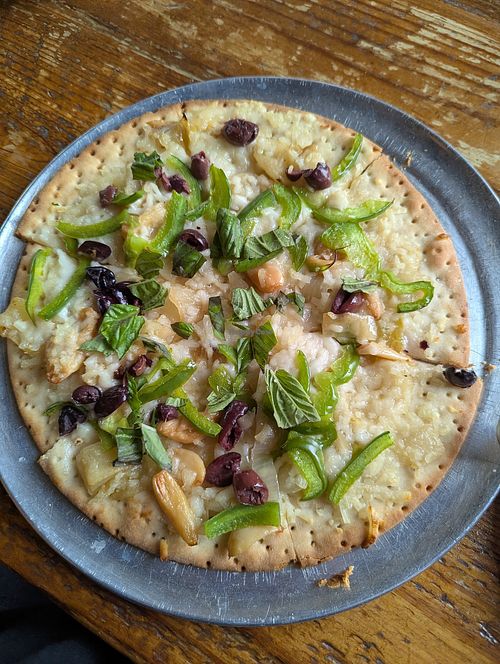 Gluten free vegan white pizza with added toppings at Hutchins Garage in Durham
