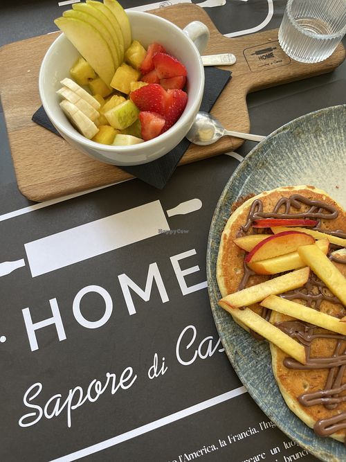 Fresh fruit with honey drizzle and peach Nutella vegan pancakes .  at The Taste of Home in Trieste