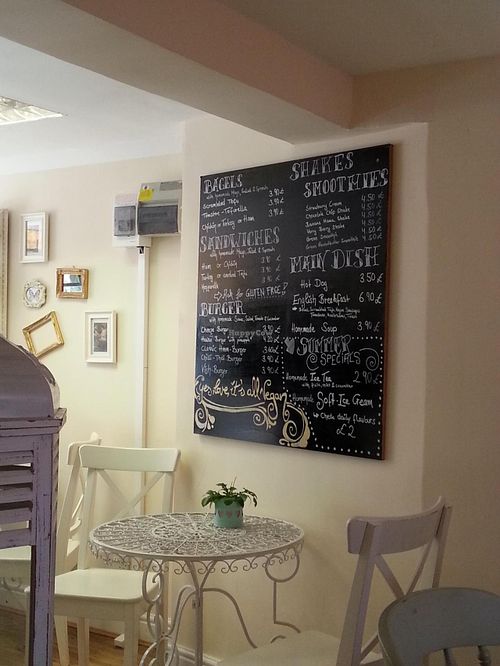 Menu board 'yes, love, it's all vegan' at Cakes 'N' Treats in North West London