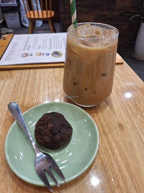 Salted caramel latte and the tiniest cookie of my life at Grazie's Kitchen - Vegan Bakery and Cafe in Da Nang
