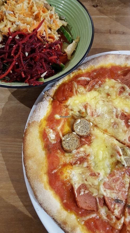 'Meaty' pizza and a fresh salad bowl at Black Cat in East London