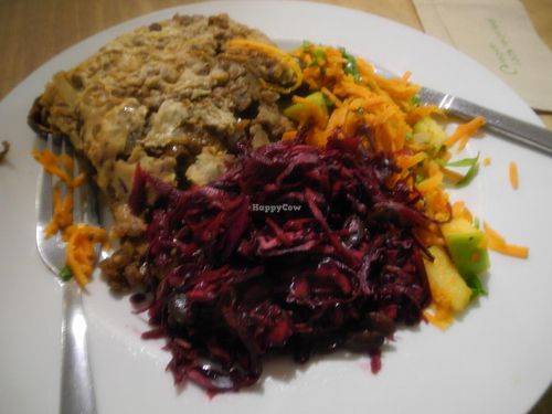 Aubergine, mushroom, and lentil moussaka with salads.

(Actually bought to represent the meal that helped convince Gandhi of the merits of vegetarianism. But that's another story ...) at Black Cat in East London