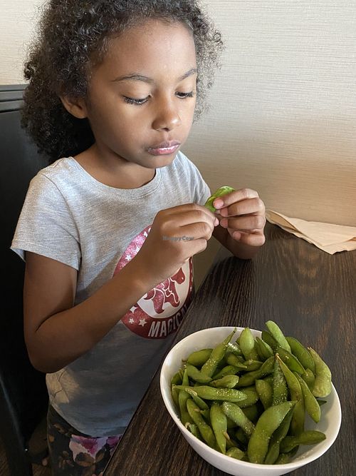 Edamame (and a cutie) 🥰   at Sirirath Thai House in Fargo
