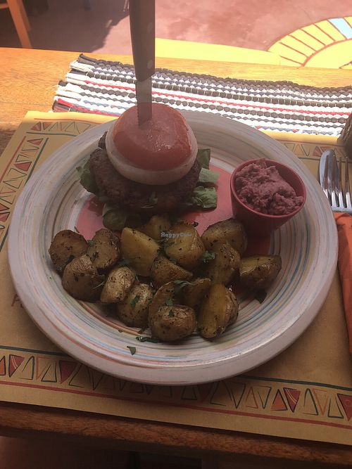 Vegan burger with baked potatoes and beetroot hummus at Tranquilo in Santorini