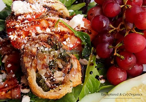 Mushroom/Kale Pastry Roll! Organic Kale, Crimini Mushrooms, Onions and Celery Sauteed, Rolled, and baked into a delicious Puff Pastry with Mozzarella and Romano Cheeses served over Mixed Greens and topped with Marinated Tomatoes w/Balsamic Drizzle!  at Sprouts Cafe in Gastonia