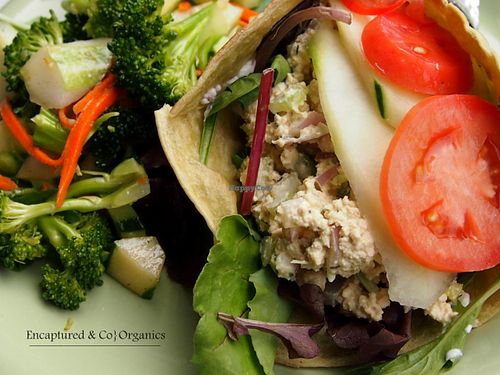 Mock Chicken Wrap! Organic, Non GMO Tofu squeezed by hand and blended with Fresh Celery, Red Onion & Garlic before being seasoned with Whole Pepper, Thyme, Veganaise Wrapped in a Spinach Tortilla with Lettuce, Tomato & Cucumber!   at Sprouts Cafe in Gastonia