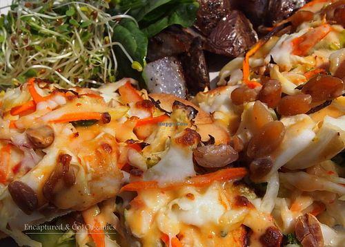 Thai Veggie Pizza! Organic Veggies Marinated in a tasty Lime Chili Dressing on a personal sized traditional crust with softened peanuts, sprinkled mozzarella cheese and finished with a drizzle of sweet chili peanut sauce! at Sprouts Cafe in Gastonia