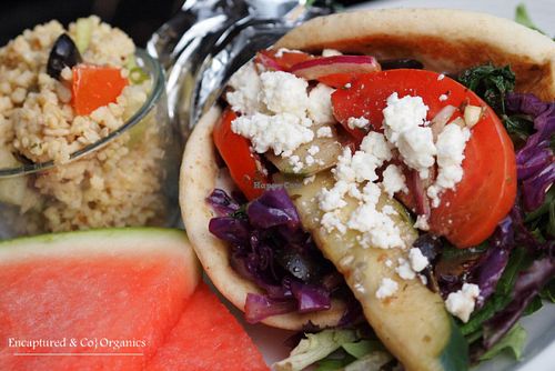 Veggie Gyro! Greek seasoned, grilled veggies including: Purple Cabbage, Carrot, Curly Kale, Bell Pepper, Zucchini in a thick traditional pita. at Sprouts Cafe in Gastonia