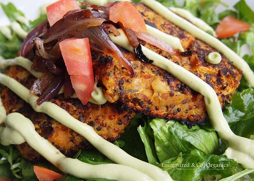 Organic, Gluten Free, Vegan Sweet Potato Patties, Roasted Butternut Squash, White Bean and Tricolor Quinoa grilled and served over Fresh Romaine and Marinated Arugula topped with Caramelized Red Onion and finished with Zesty Avocado Lime Sauce!  at Sprouts Cafe in Gastonia