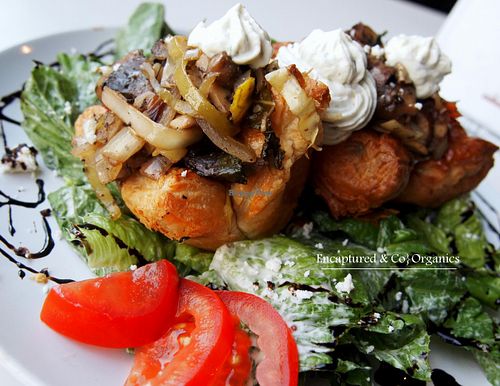 Puffy Mushroom Pastry w/Basil Garlic Creamy Cheese A beautiful floral shaped Puff Pastry filled with Savory Sauteed Button, Crimini and Portobello Mushrooms, Sweet Onion, Leeks and other Organic Veggies!   at Sprouts Cafe in Gastonia