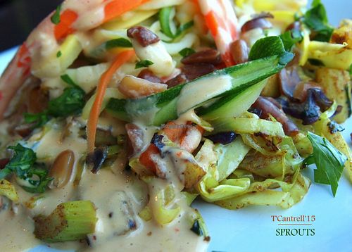 Veggie Pad Thai Day! Zucchini Carrot and Yellow Squash Noodles with curry stir fried organic veggies topped with softened chopped peanuts and a drizzle of tai coconut peanut sauce. at Sprouts Cafe in Gastonia
