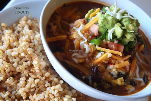 Veggie and Bean Chili made with Black & Red Beans, Onion, Peppers, Garlic, Carrots, Butternut Squash, Tomatoes and Kale topped with tasty Pico de Gallo, Tangy Avocado, Cheddar and Mozzarella cheeses!  at Sprouts Cafe in Gastonia