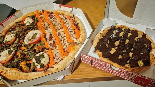 Half caprese, half sausage cheddar + banana veganella at Forneria Original in Recife