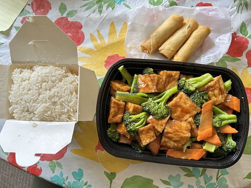 Tofu and Broccoli 🥦 with a side of spring rolls !  at Hunan Garden in Mankato