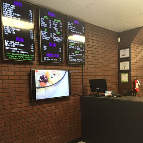 reception desk & menu at Nourished On The Go in Oshawa