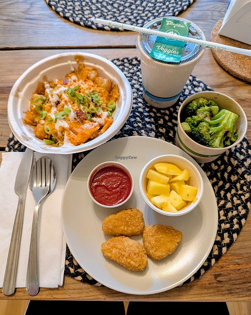 Kids Meal with Nuggets, Ketchup, Broccoli, Mango, and Black Tea; Chili Chz Tots at Veggie Grill by Next Level - Downtown in Seattle