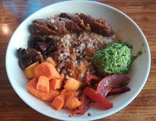 Rustic farm bowl + apple sage sausage at Veggie Grill by Next Level - Downtown in Seattle