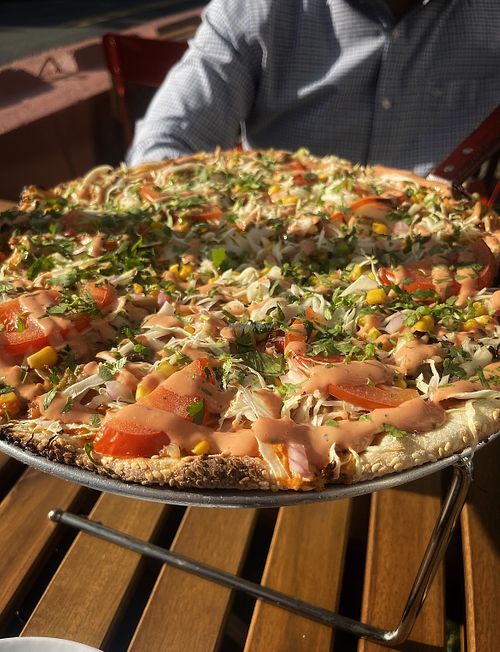Impossible Chimi pizza. Impossible meat, cabbage, corn, and tomatoes topped with cilantro and chimi sauce, so delicious!  at Wahizza  in Ridgefield Park