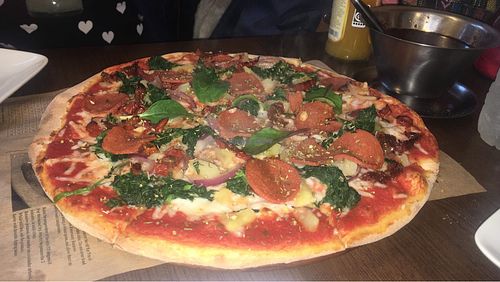 Pepperoni, spinach, sundries tomatoes and pineapple   at Express Pizza in Copenhagen