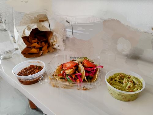 Vegetarian beans, chips, guacamole, and veggie tacos (I added shrimp that came on my partner's burger so just ignore those). at ZOCA in Bethany Beach