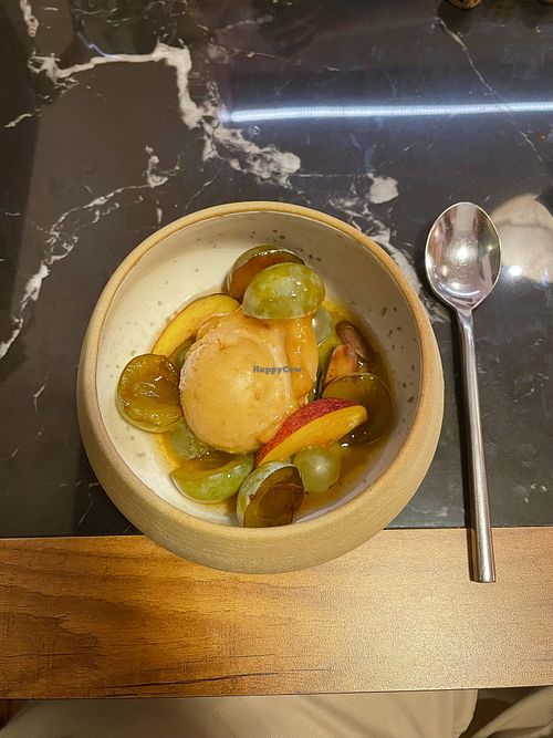 Mirabelle  sorbet with grape and plum compote, peach slices, and almonds  at La Terrasse des Carmes in Saint-thome