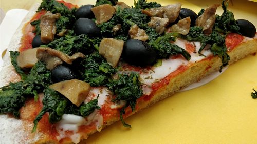 pizza with mushroom, black olives and spinach  at Natural Food in Lugano