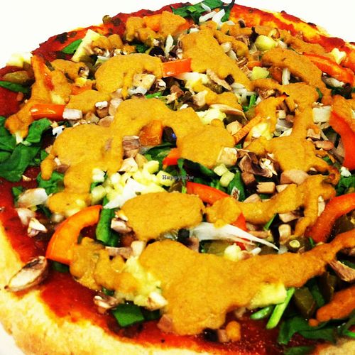 Veggie loaded pizza topped with cashew cheese at Cashew in Chattanooga