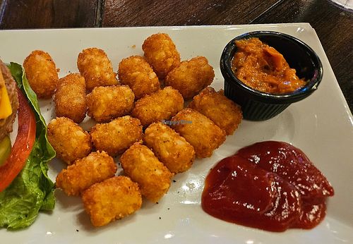 Vegan cheese burger with tater tots at Empire Square in Watertown