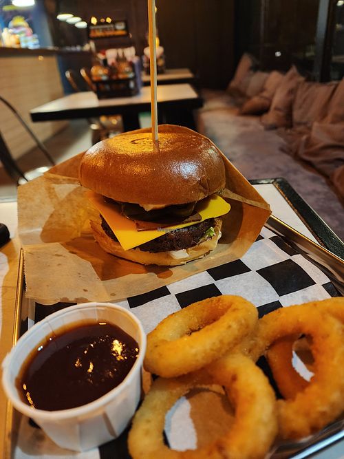 Spicy bacon vegan burger with onion rings + bbq sauce at Teddy's Burger N' Bar in Warsaw
