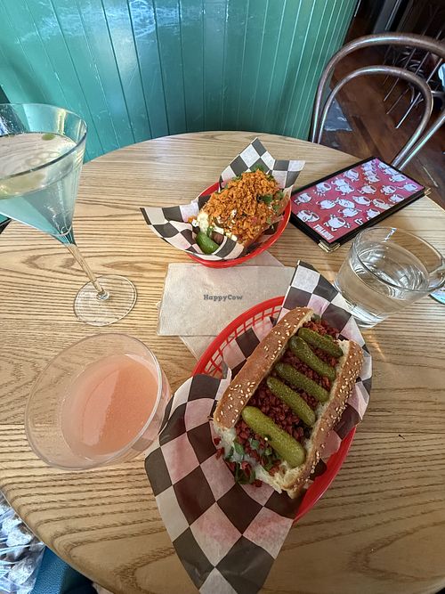 green curry martini and elote dog at the top, and guava martini and truffle glizz on the bottomm  at Tallboy in Oakland
