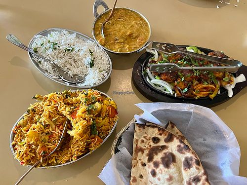 Vegetable biriani, Basmati rice, vegetable curry, tandoori mushrooms & bread (clockwise from lower left) at Tandoori Grill in Fresno
