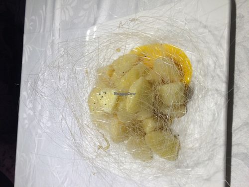 The exquisite, devine and far too filling Apple Deep Fried with Syrup.  Please do not attempt to eat this alone after a big meal! at Hetian Xinyu - Lotus Vegetarian in Dalian