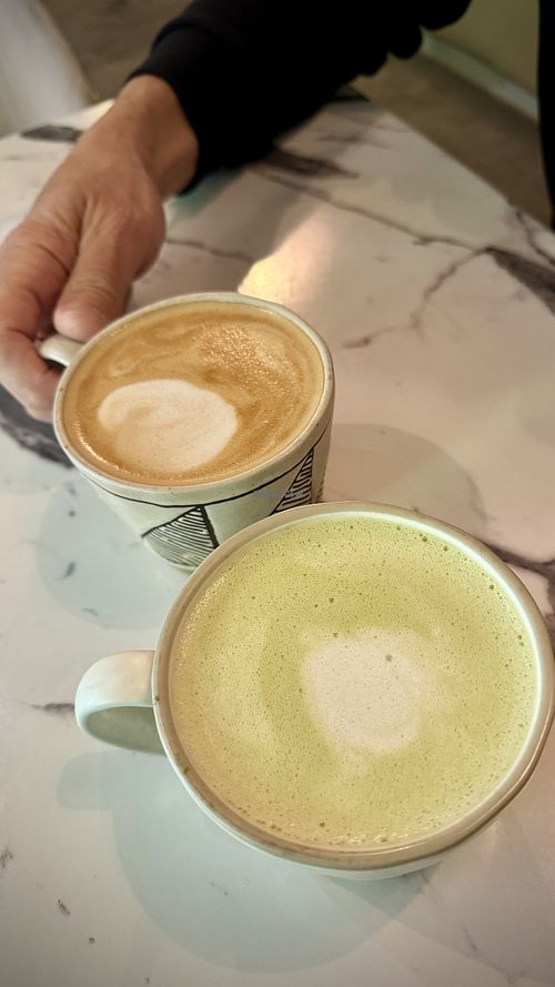Matcha and coffee oat lattes   at WaffleLand Cafe in Vancouver